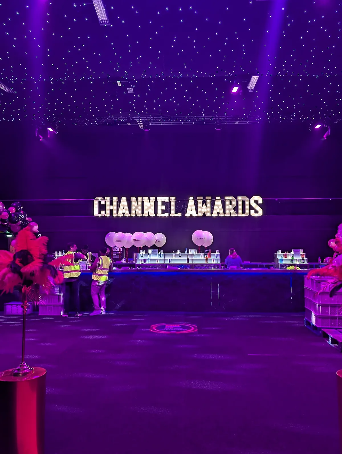 Large illuminated event letters creating a statement backdrop for a Central London event